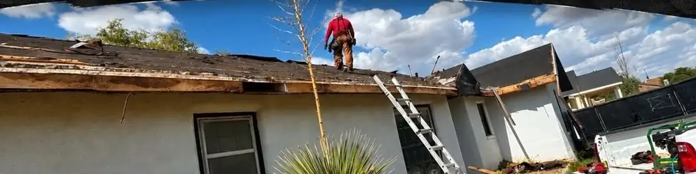 Davis crew member working on a roof replacement