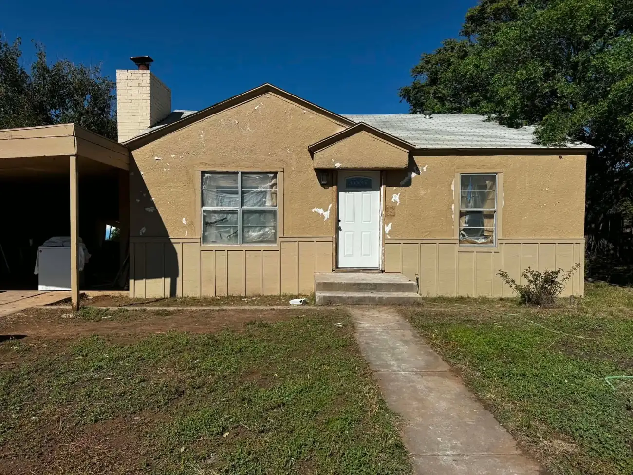 Stucco house exterior during renovation